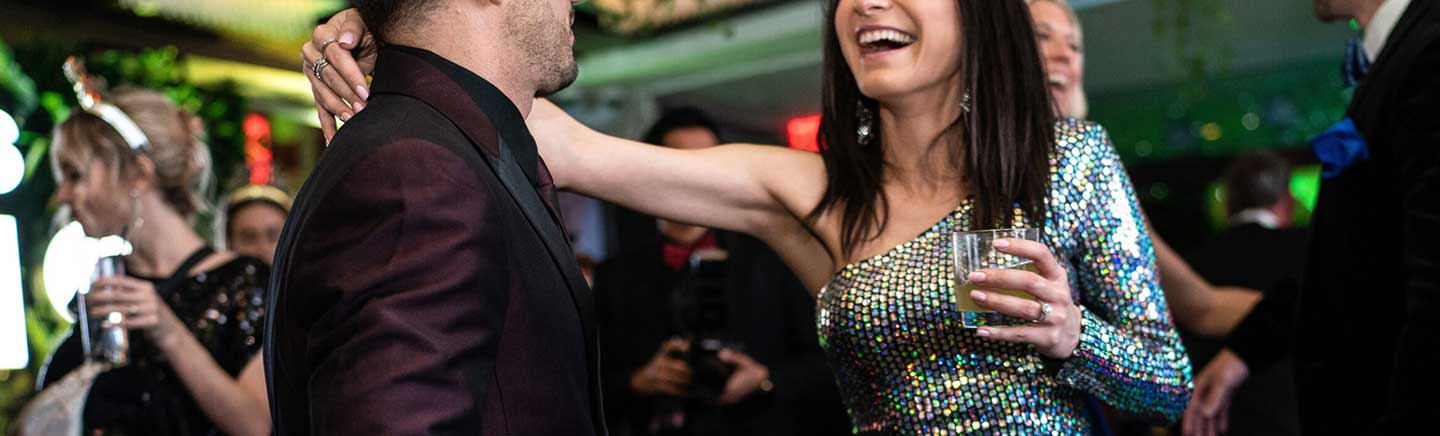 man and woman embracing in a club